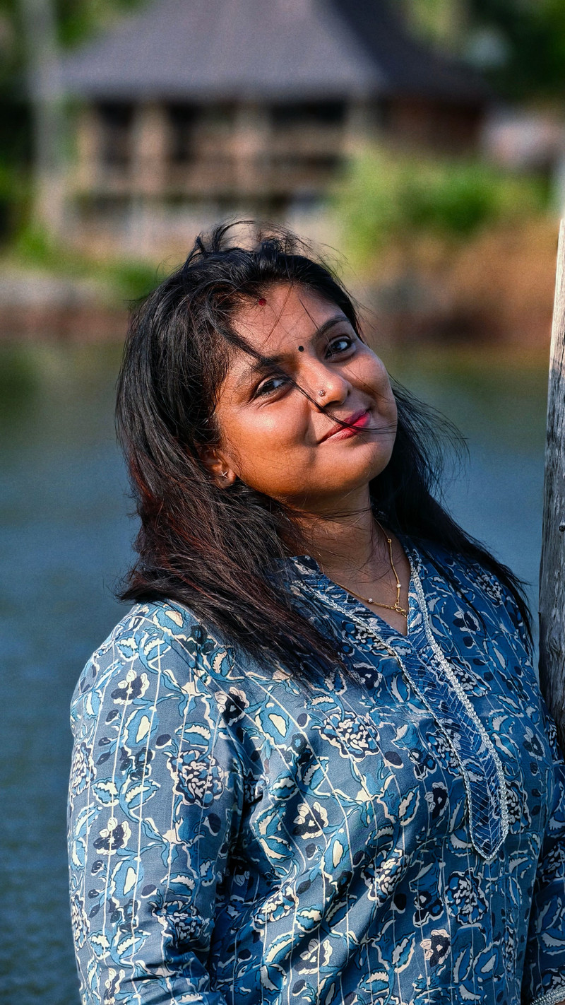 An indigo block-print kurta by a lake.