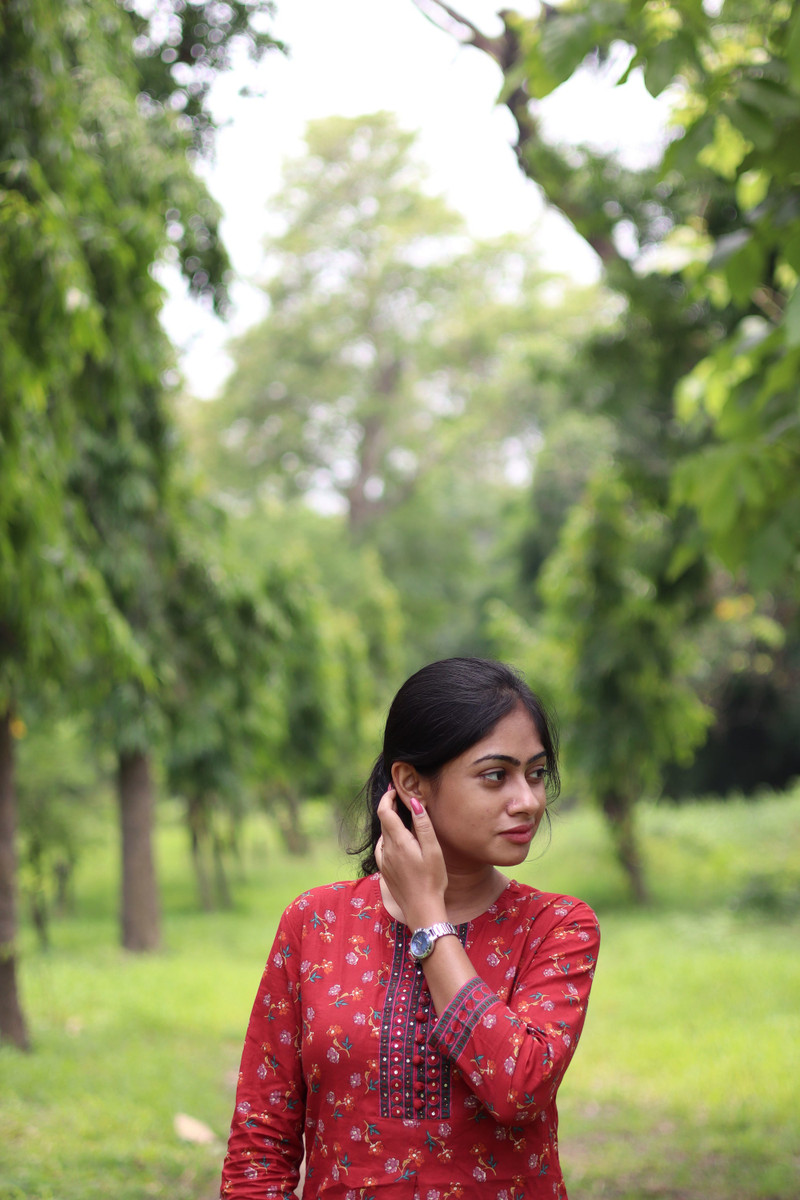 The red kurta among the trees.