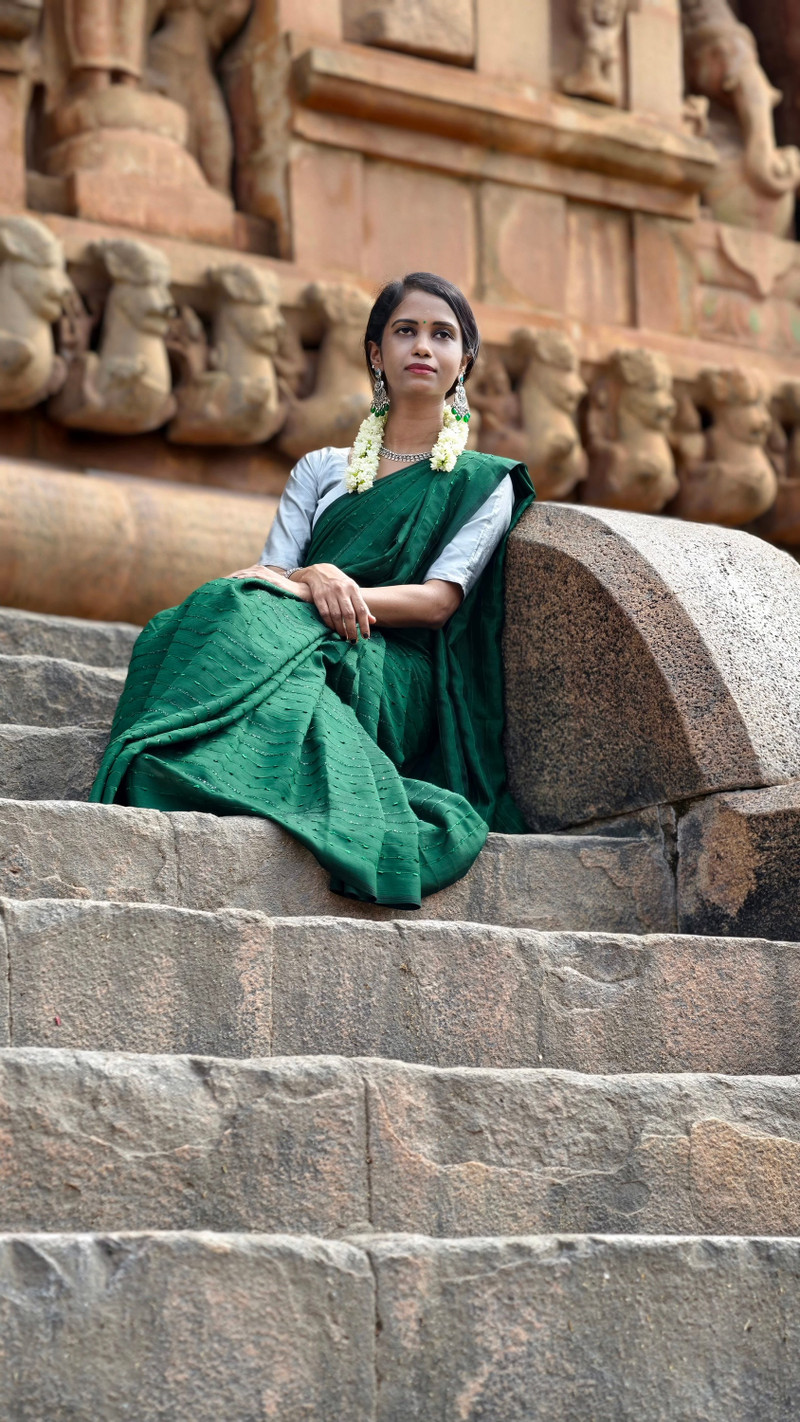 The emerald silk saree on the temple steps.